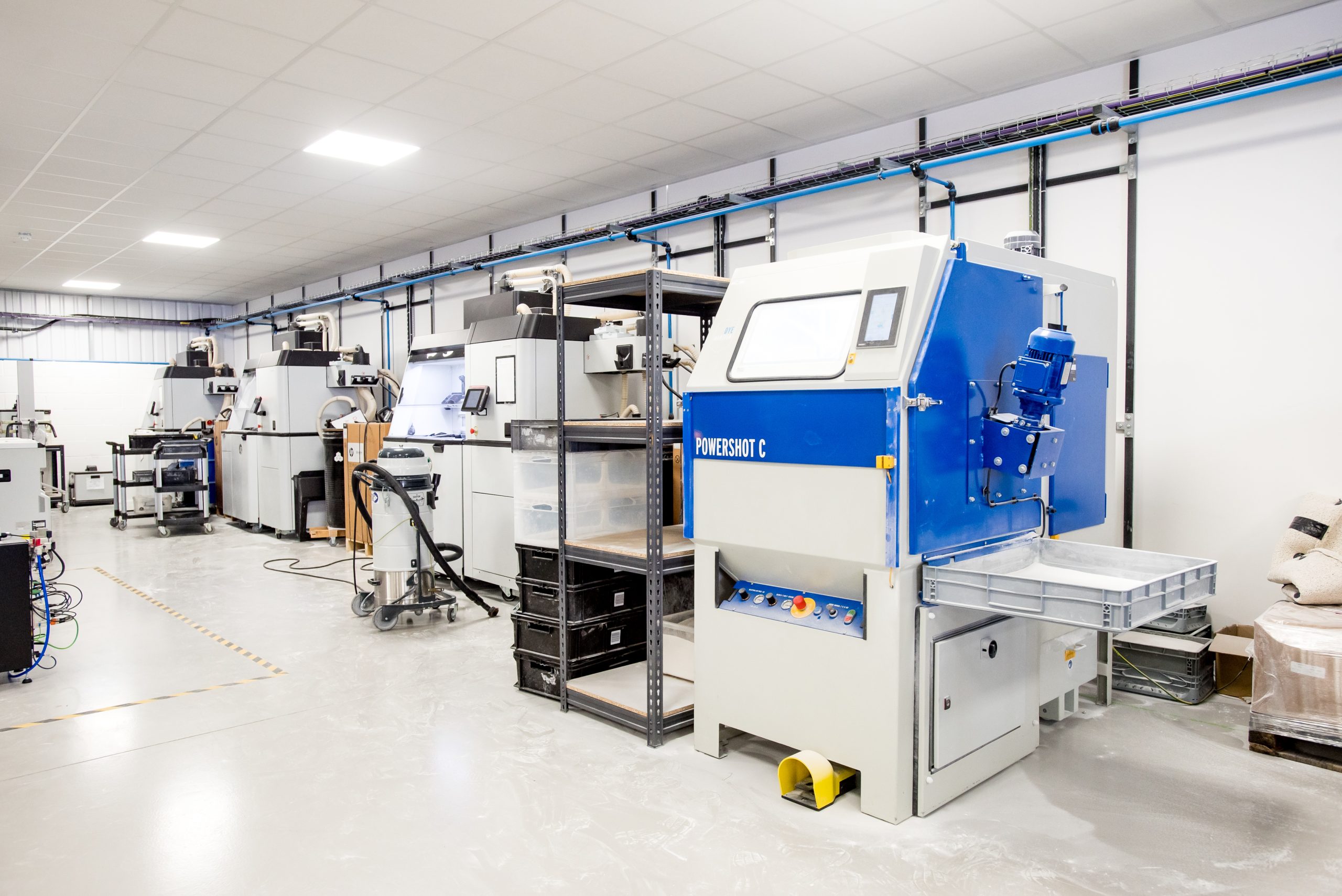 A room showing multiple 3D printing units.