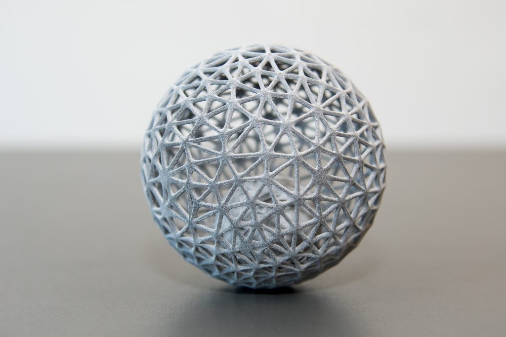 A 3D printed sphere. The sphere is hollow and is made up of a triangular mesh.